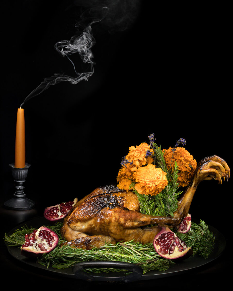 Mead pomegranate roast chicken with marigold bouquet.