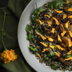 A chanterelle mushroom rice recipe with marigold petals.